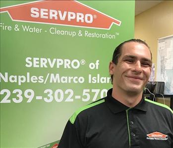 male employee with brown hair and a black SERVPO shirt