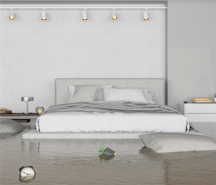 a flooded bedroom with water covering the floor
